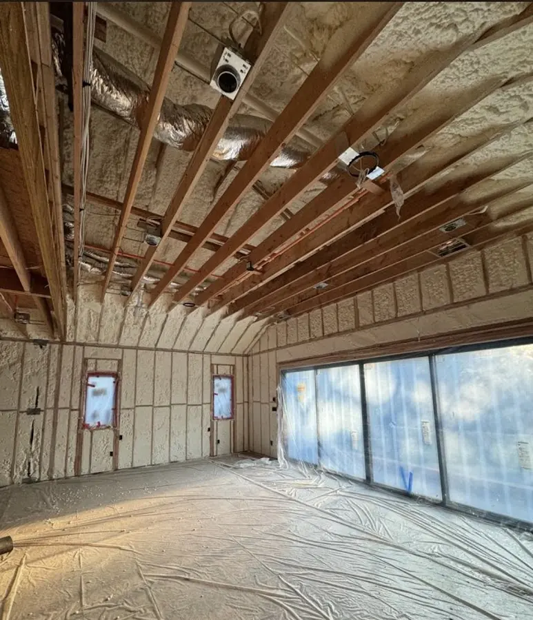 Interior walls and ceiling insulated with spray foam during new construction in Ennis